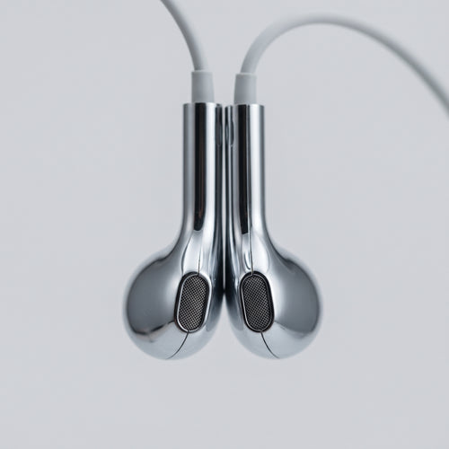 Close-up of the two mirror-chrome earbud housings and mesh grilles